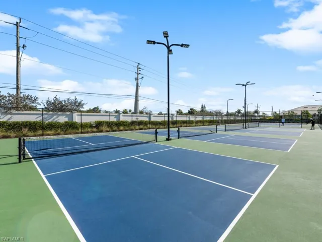 View of sport court featuring community basketball court and fence