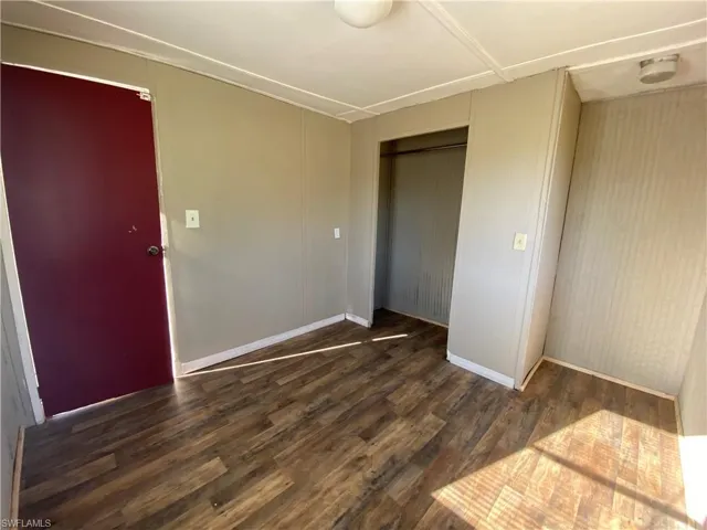 Spare room featuring wood finished floors