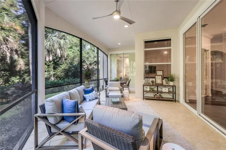 Sunroom featuring ceiling fan