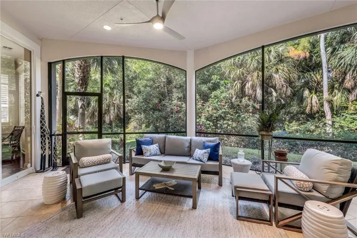 Sunroom with a healthy amount of sunlight and ceiling fan