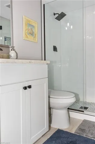 Full bath with vanity and a stall shower