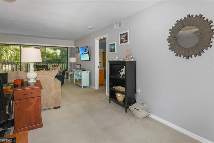 Office area with light carpet and baseboards