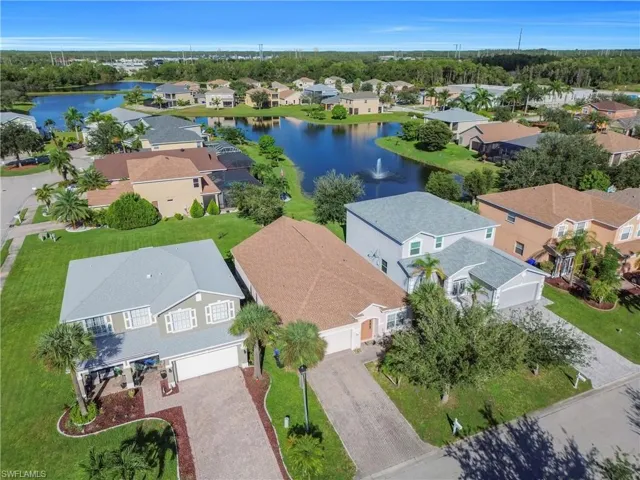 Aerial perspective of suburban area with a large body of water