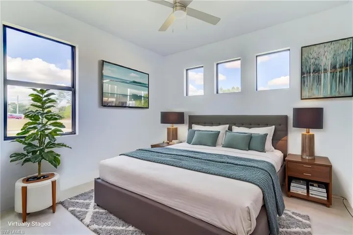 Bedroom featuring ceiling fan and baseboards