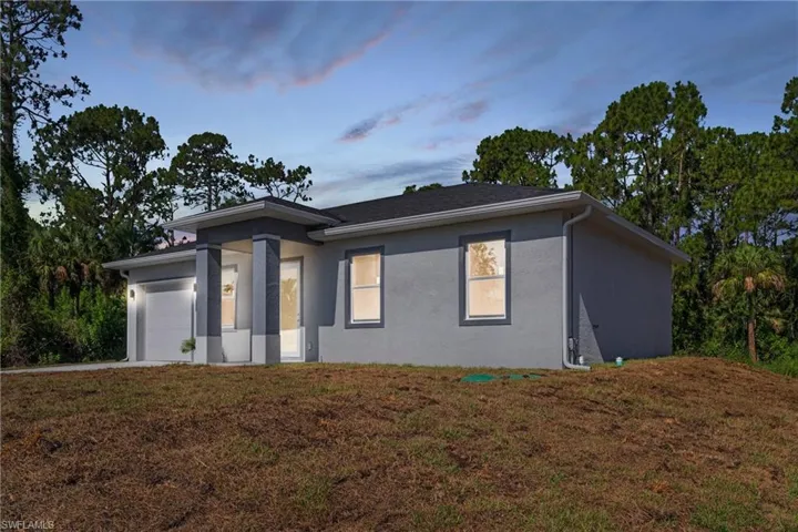 View of front of house with a yard