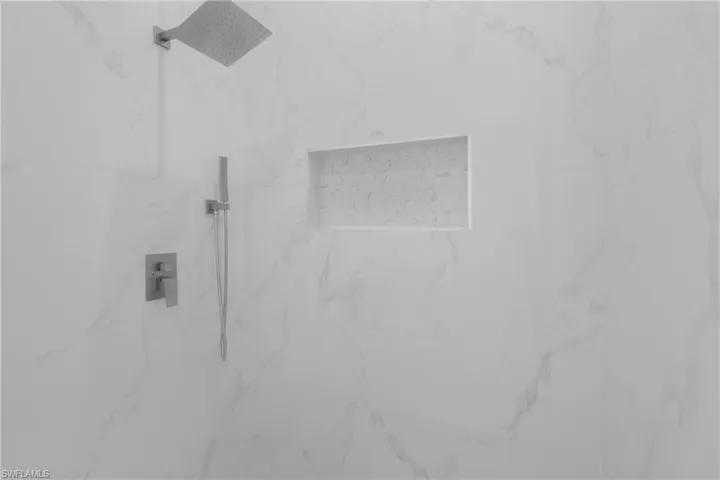 Details featuring tiled shower