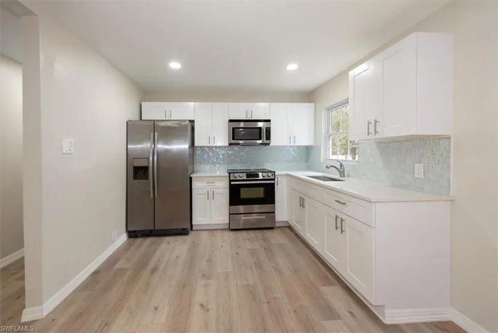 Recently updated with tiled back splash & new cabinets.