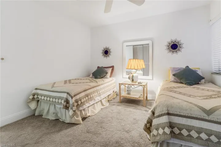 Bedroom with ceiling fan and carpet floors