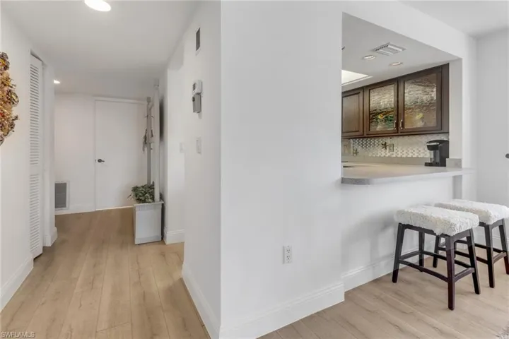 Hall featuring light hardwood / wood-style flooring
