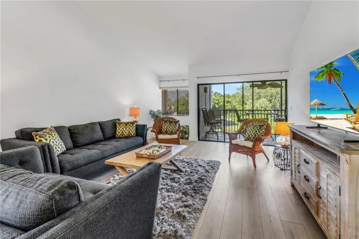 Living room with light wood-type flooring