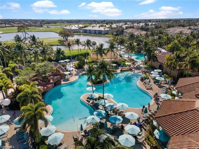 View of pool with a water view and a patio