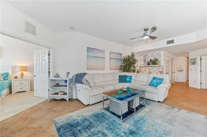 Tiled living room with ceiling fan