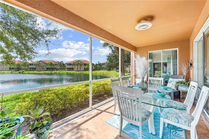 Sunroom / solarium featuring a water view and a healthy amount of sunlight