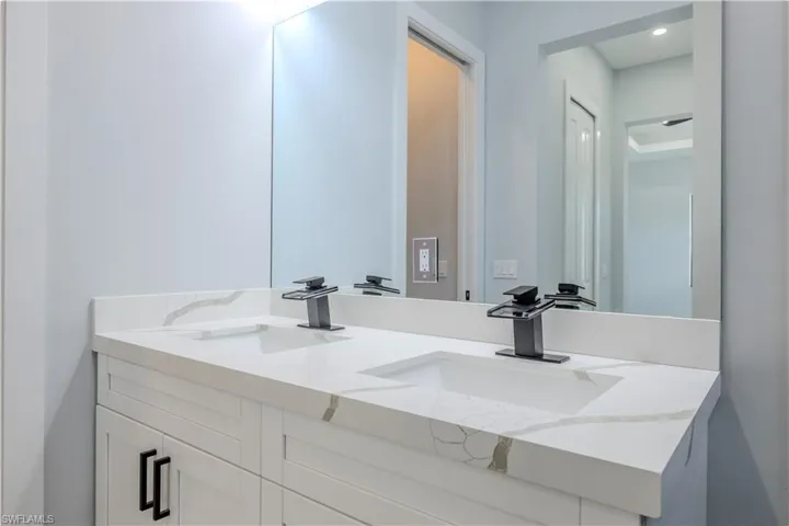 Full bathroom featuring double vanity