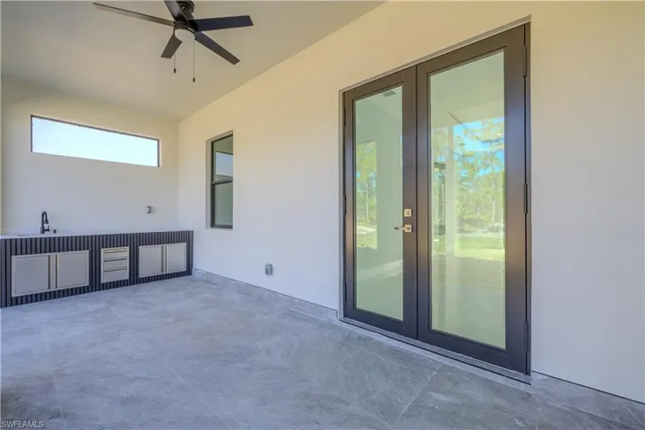 View of patio featuring ceiling fan