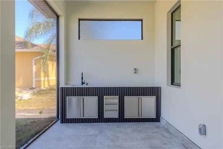 Unfurnished sunroom with a sink