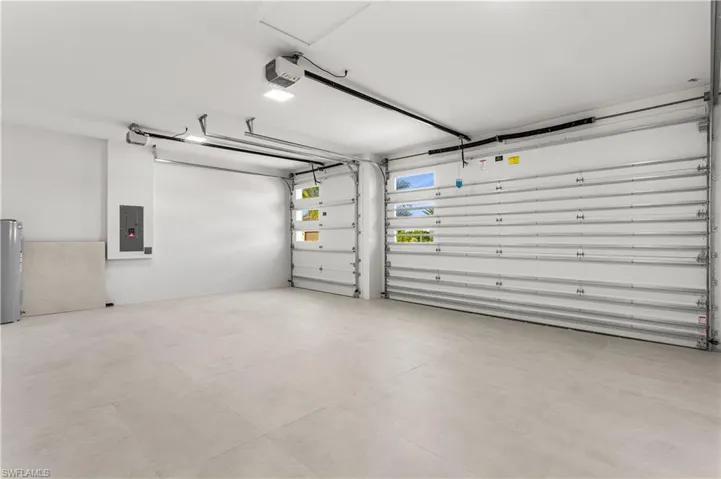 3-CAR GARAGE w/ GLASS PANELS & INSULATED DOORS & CEILING enhances HOME ENERGY EFFICIENCY