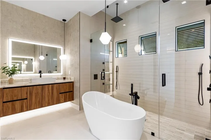 STANDALONE TUB with hand-held shower head & designer's lights!