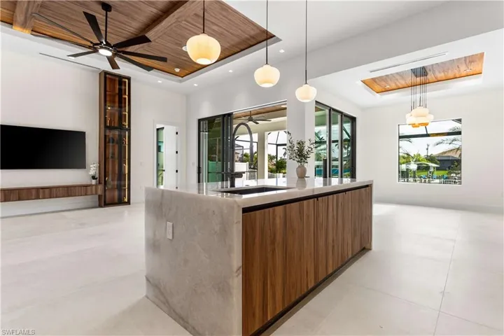 WATERFALL KITCHEN ISLAND w/ CRISTALLO QUARTZITE, DACOR integrated dishwasher & large sink w/ WATERFALL FAUCET add on
