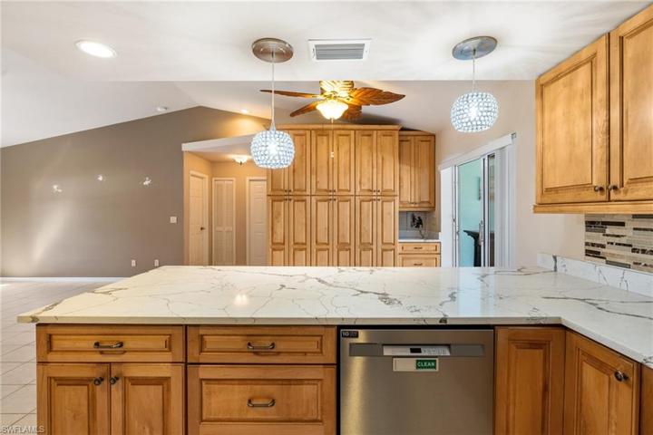 Island seating.  Quartz countertops.