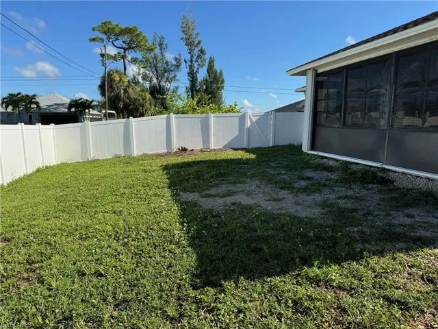 View of yard with a sunroom