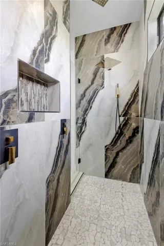 Bathroom featuring tile walls and tile patterned floors