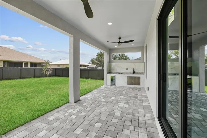 View of patio / terrace featuring sink and ceiling fan