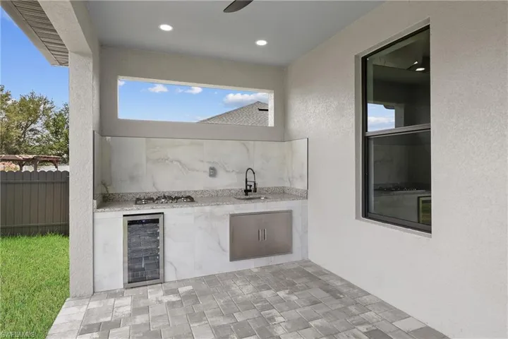 View of patio / terrace with sink and wine cooler