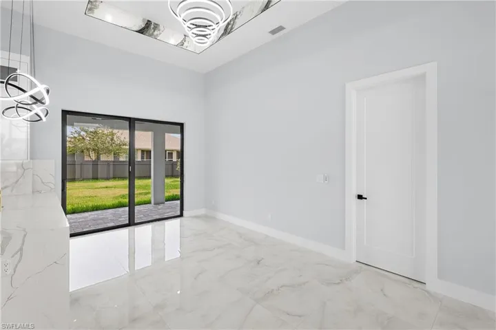 Empty room with light tile patterned flooring