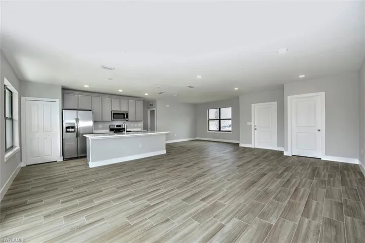 Unfurnished living room featuring light hardwood / wood-style flooring