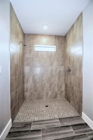 Bathroom featuring a tile shower