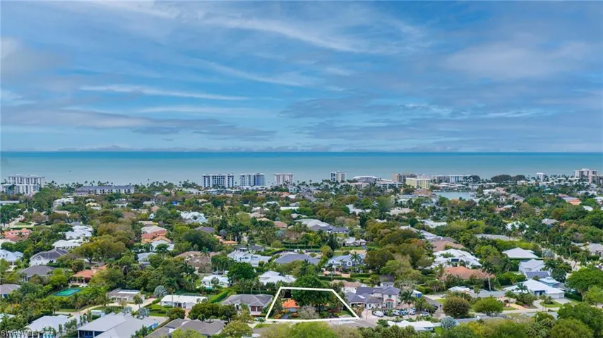 View of urban area featuring property boundaries highlighted, a nearby body of water, and nearby suburban area