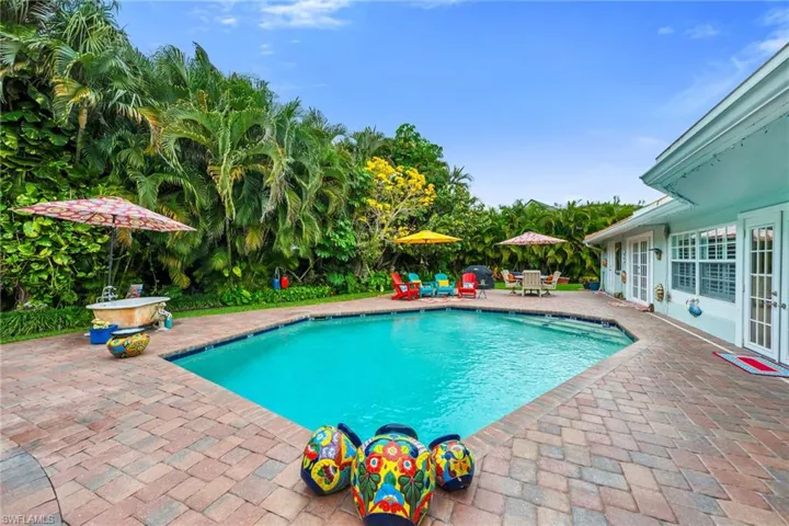 Swimming pool featuring a patio area and french doors