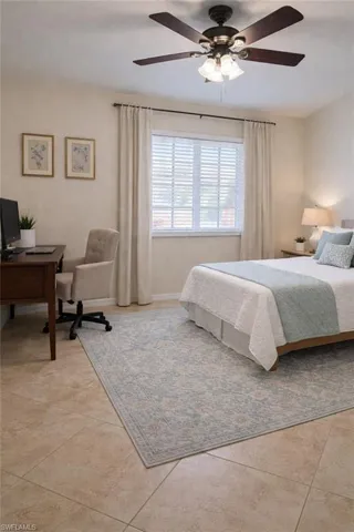 Bedroom featuring a desk and ceiling fan