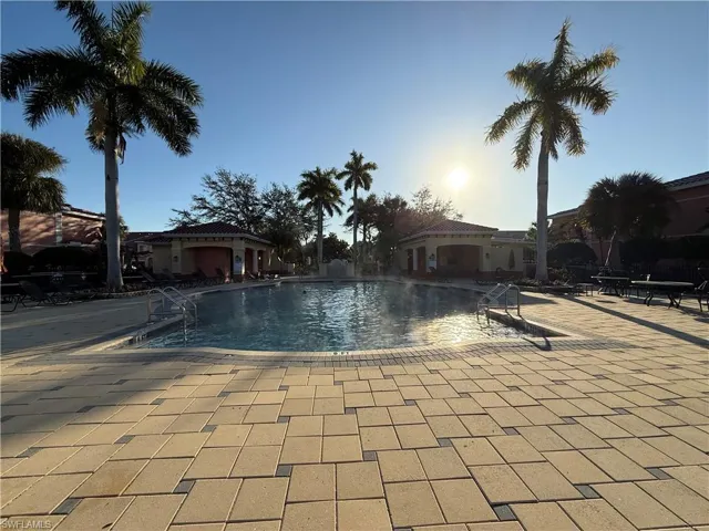 Community pool with a patio area