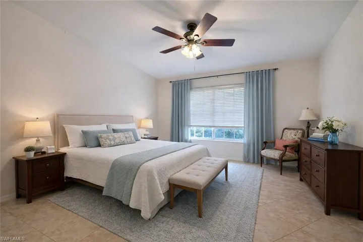 Bedroom featuring a ceiling fan and light tile patterned floors