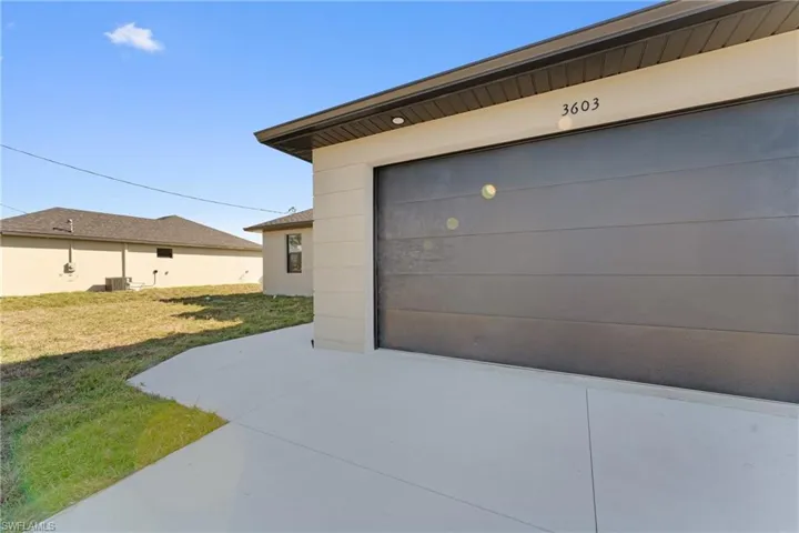Garage with cooling unit and a yard