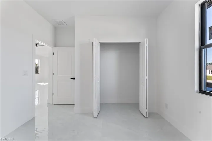 Unfurnished bedroom with a closet