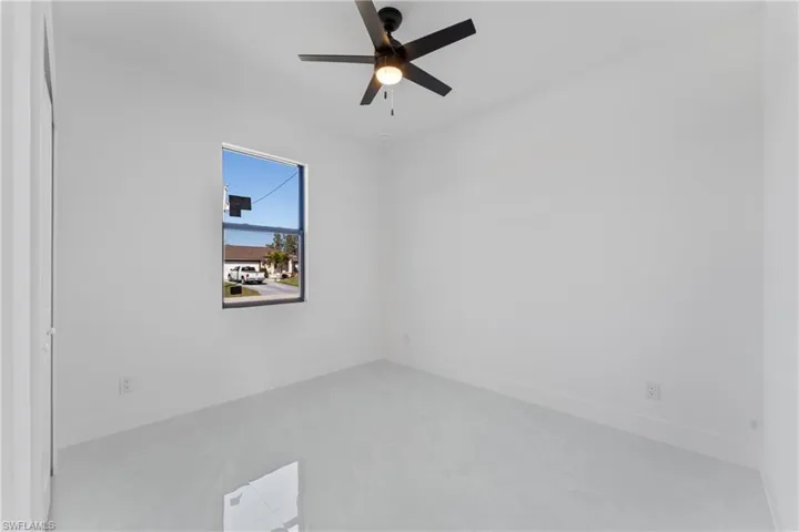 Spare room with ceiling fan