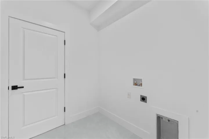 Clothes washing area with hookup for an electric dryer and hookup for a washing machine