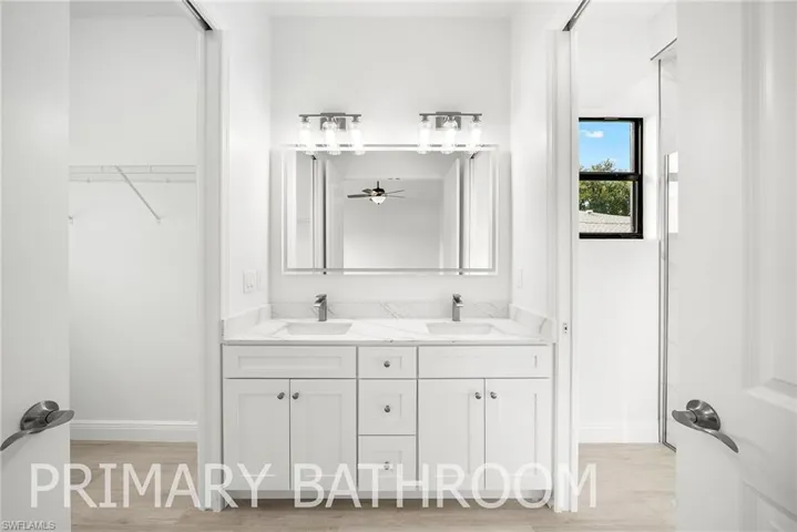 Bathroom with vanity and hardwood / wood-style floors