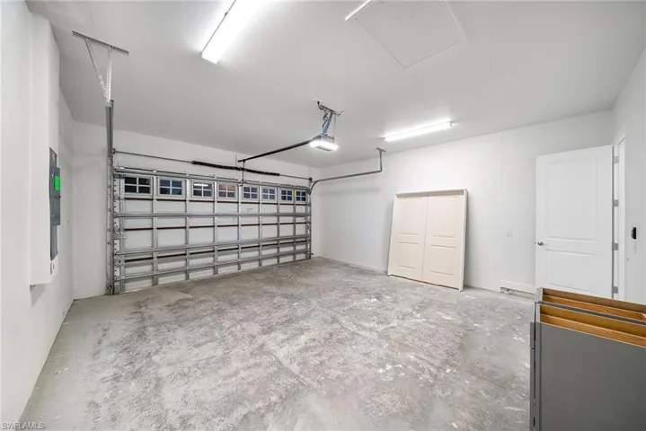 Garage featuring a garage door opener
