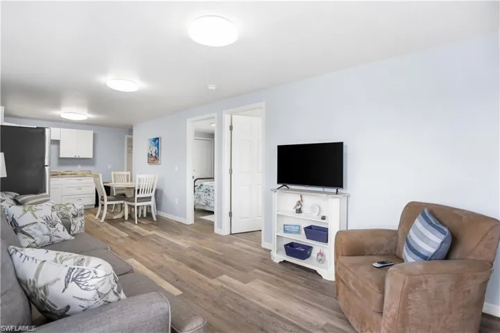 Living room with hardwood / wood-style floors
