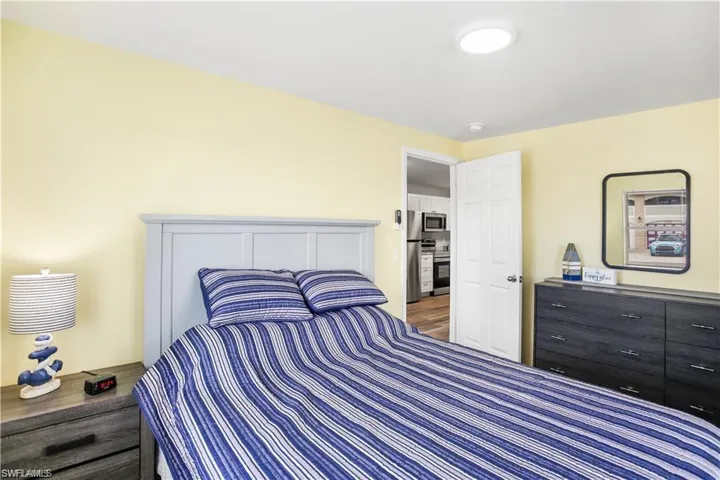 Bedroom with hardwood / wood-style flooring