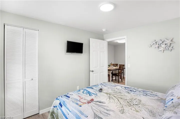 Bedroom featuring a closet and hardwood / wood-style floors