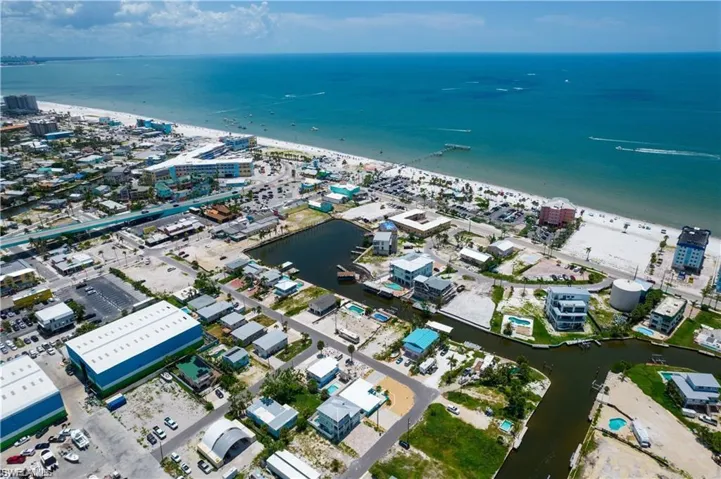 Bird's eye view featuring a view of the beach and a water view
