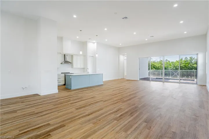 Unfurnished living room with light hardwood / wood-style floors