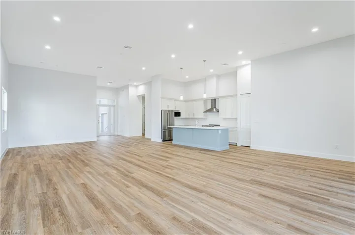 Unfurnished living room with light hardwood / wood-style flooring