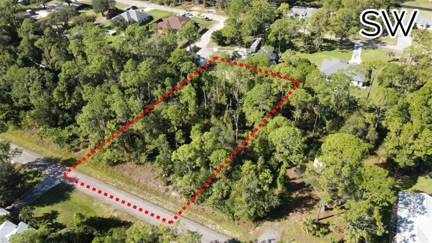 Aerial view of property and surrounding area featuring property boundaries highlighted