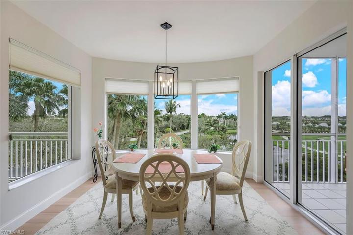 Tropical greenery surrounds you in this lovely dining space, just off the kitchen.